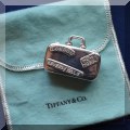 J16. Tiffany & Co. sterling silver minature suitcase pillbox. 